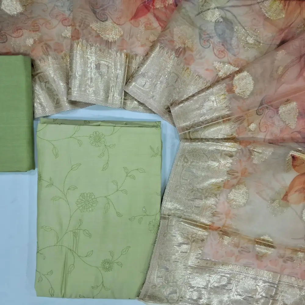 Pastel green silk cotton unstitched salwar material (lining needed) self embroidery allover,silky bottom, digital printed fancy organza dupatta with zari buttas & borders.JN262818