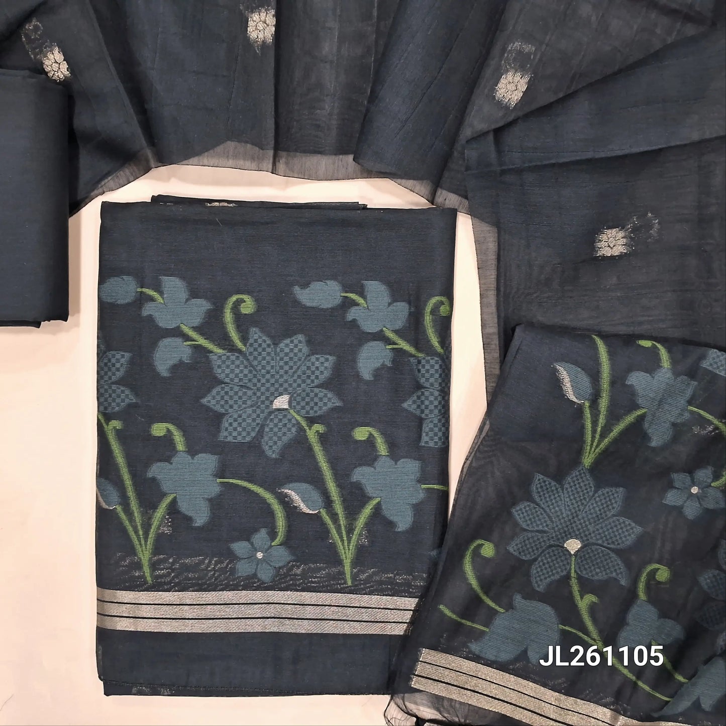 Black jamdani woven silk cotton unstitched salwar material, thread and zari buttas on front,floral weaving daman, (lining needed) silk cotton bottom,jamdani woven and self checked weaving with buttas on full length silk cotton dupatta with pallu. JL261105