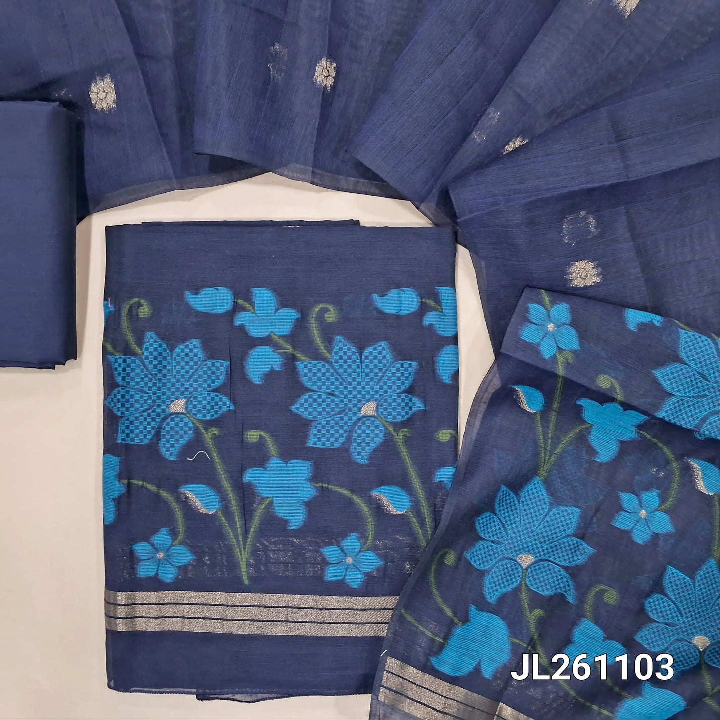 Dark blue jamdani woven silk cotton unstitched salwar material,thread and zari buttas on front,weaving daman, (lining needed) silk cotton bottom,jamdani woven and self checked weaving on full length silk cotton dupatta with pallu. JL261103