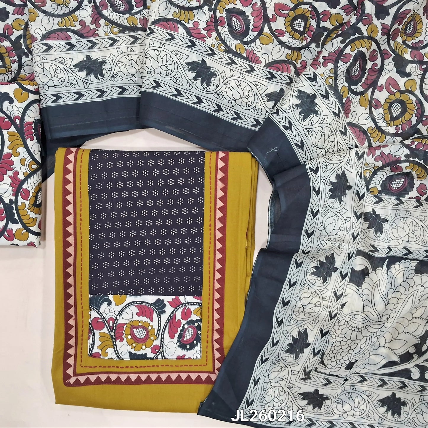 Mehandhi yellow premium dabu cotton unstitched salwar material,ajrak yoke patch and kalamkari work,hand embroidery & mirror work on front(soft,lining optional)kalamkari cotton bottom, kalamkari printed mul cotton dupatta. JL260216