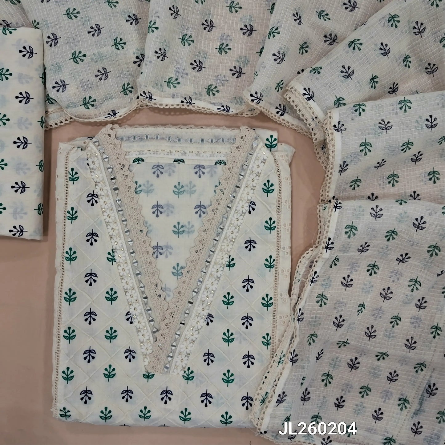 Off white cotton unstitched salwar material,collar neck with real mirror,(blue and green)pintex work on front,panel design,(lining needed)schiffli cotton bottom,block printed pure kota cotton dupatta with lace work. JL260204