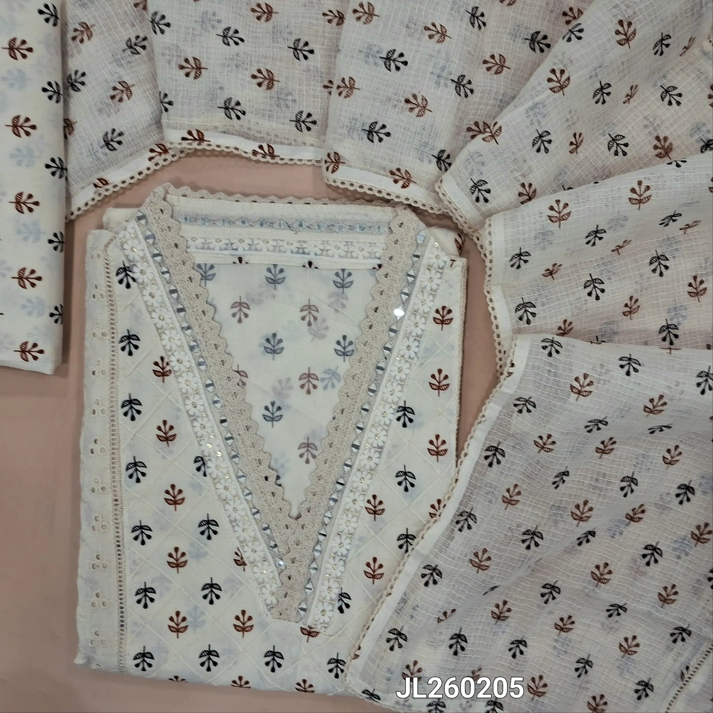 Off white cotton unstitched salwar material,collar neck with real mirror,(black and brown)pintex work on front,panel design,(lining needed)schiffli cotton bottom,block printed pure kota cotton dupatta with lace work. JL260205