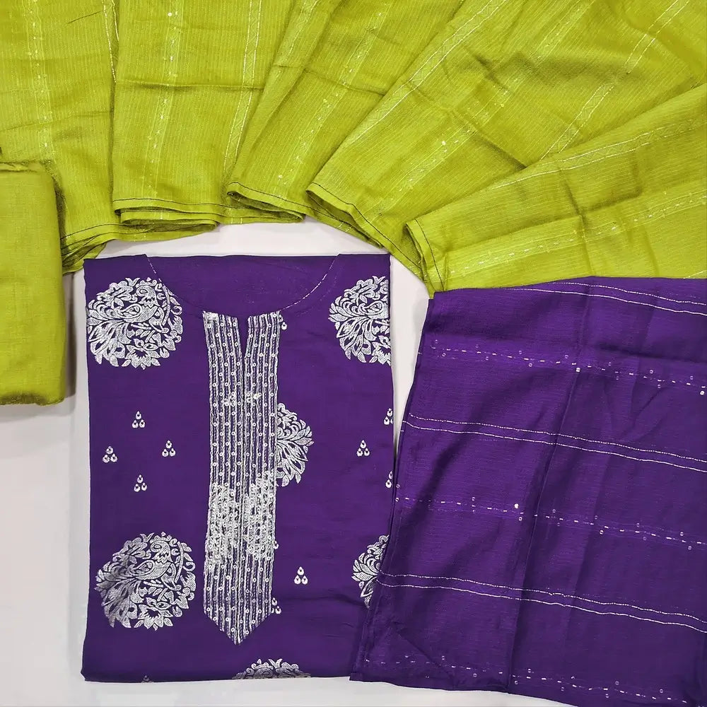 Designer purple semi raw silk unstitched salwar material, zari& sequins work on yoke, floral prints all over(lining optional) bright green silk cotton bottom,zari & sequins work on dual shaded silk cotton dupatta. JL260501