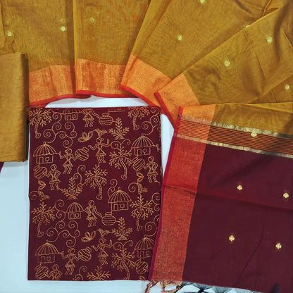 Reddish maroon & yellow warli embroidery chanderi silk cotton unstitched salwar material,thread embroidery work on front (light weight,Lining Needed) silky bottom, dual shaded chanderi silk cotton dupatta with zari buttas and gold tissue borders. JL260503