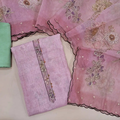 Pastel pink tissue linen unstitched salwar material (lining needed) zari& floral prints work on daman,sobar printed all over,pastel green santoon bottom,zari & floral prints organza dupatta with scallop borders. JL260515