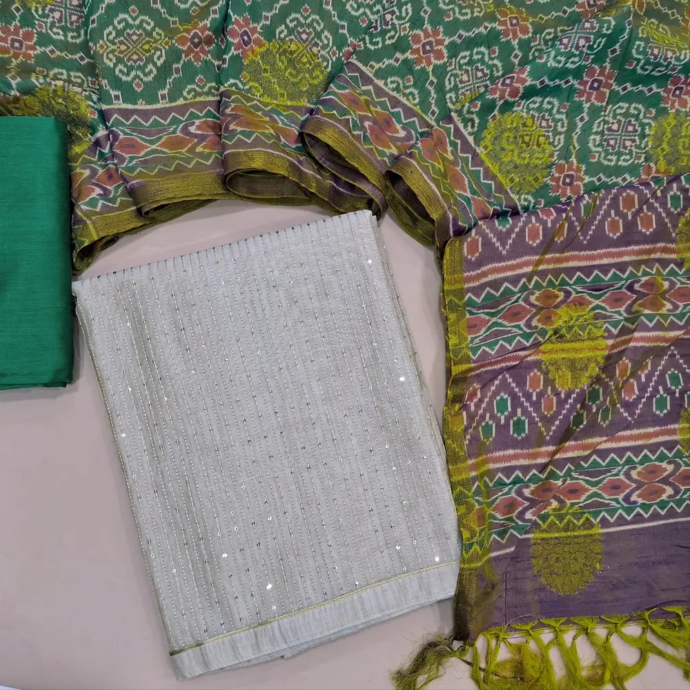 Light beige silk cotton unstitched salwar material,(lining needed)thread & sequins work all over, turquoise green silk cotton bottom,self woven buttas on ikat printed soft silk cotton dupatta. JL260518