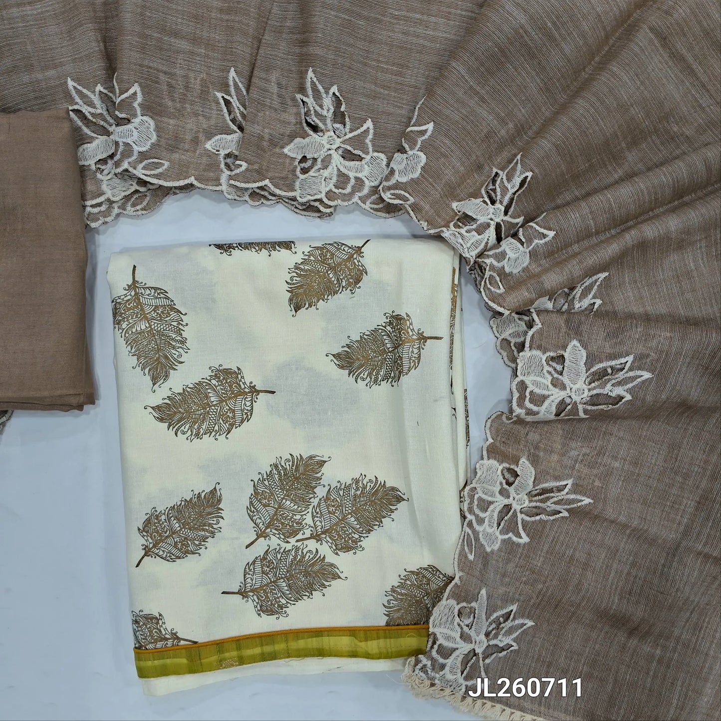 Off white printed cotton unstitched salwar material (lining optional)greyish beige santoon bottom,cotton dupatta with cut work borders &scallop edges. JL260711