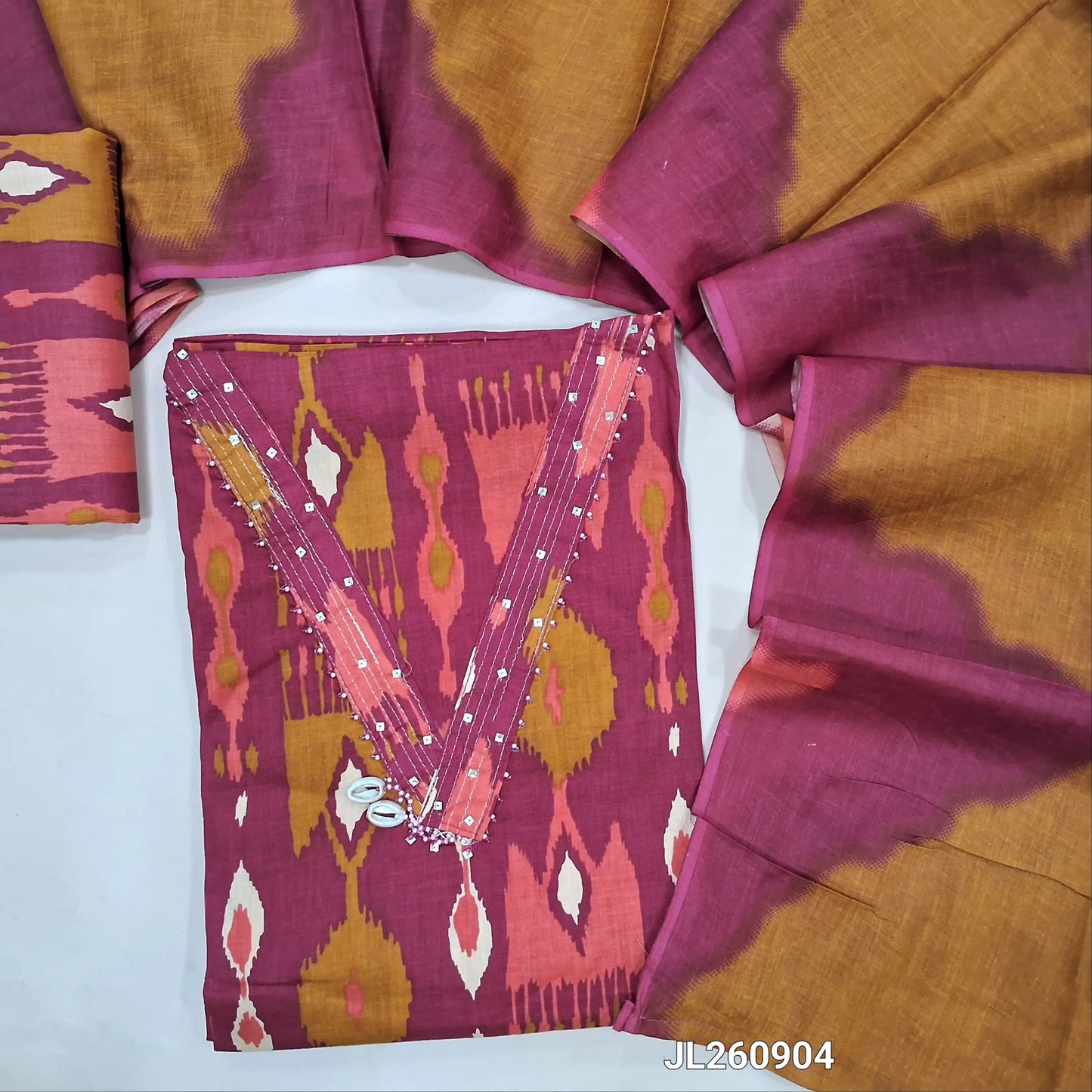 Dark pink pure cotton unstitched salwar material,zari linen & fancy shell buttons work on yoke, abstract printed all over (lining optional) printed cotton bottom, multicolor pure mul cotton dupatta.JL260904