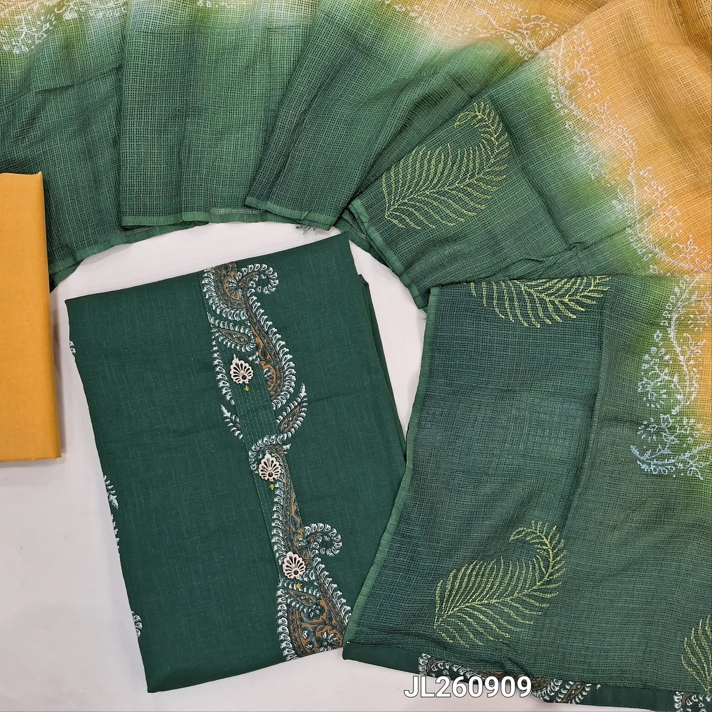 Bottle green  printed pure cotton unstitched salwar material,fancy buttons work on yoke,printed all over (lining optional) yellow cotton bottom, block printed fancy kota silk cotton dupatta.JL260909