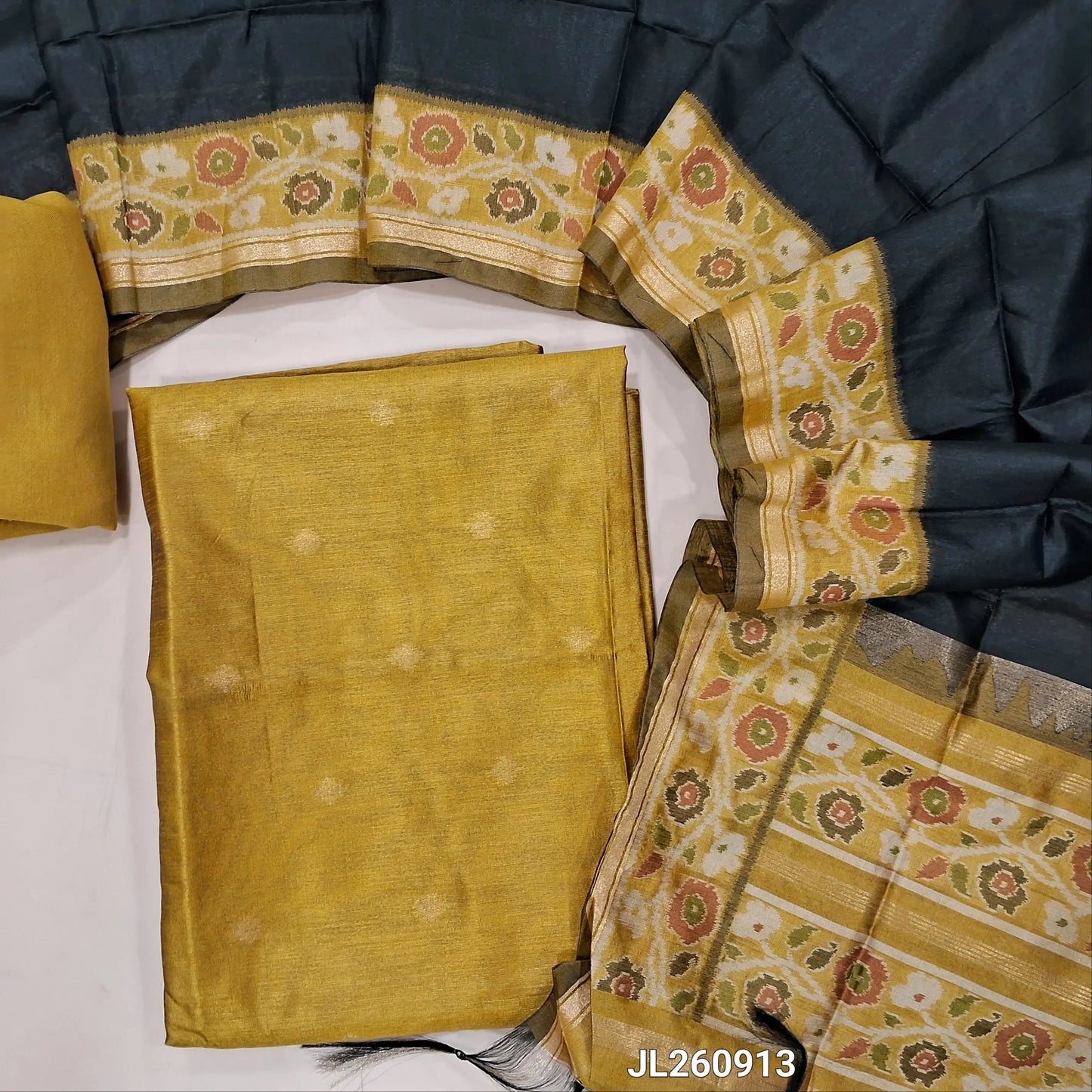 Mehandhi yellow premium silk unstitched salwar material (light weight,lining needed)zari buttas front,gold tissue border on daman,matching santoon bottom,dual shade thread weaving on silk dupatta with rich pallu & tassles.JL260913