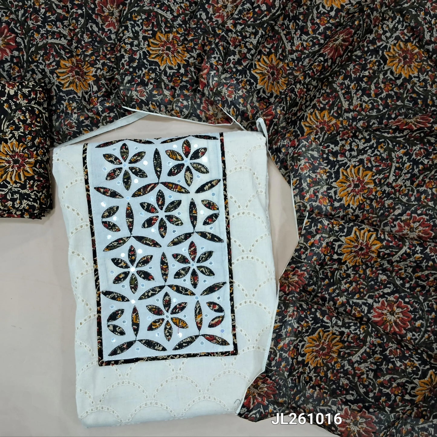 Off white base schiffli embroidered pure cotton unstitched salwar material(lining needed) applique & faux mirror work on yoke, kalamkari printed cotton bottom, kalamkari printed full length mul cotton dupatta. JL261016