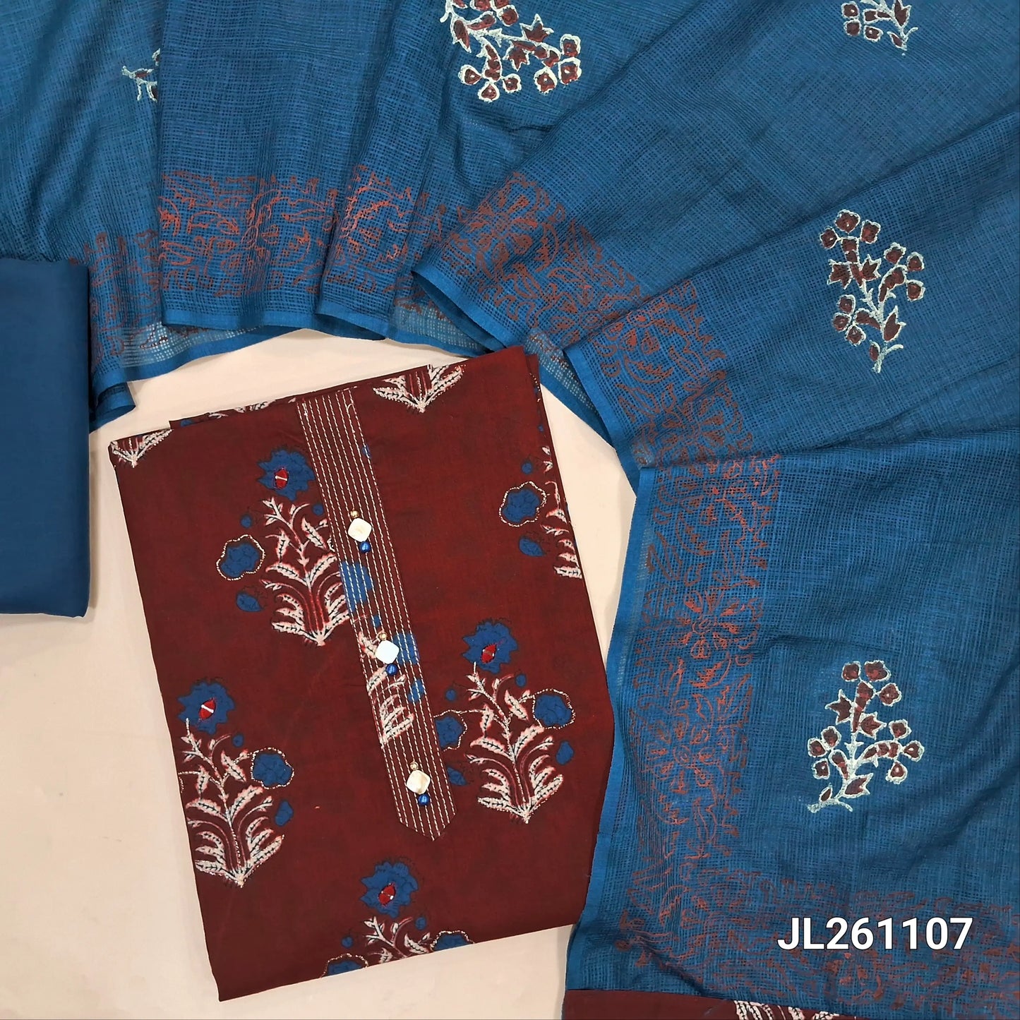 Maroon pure cotton unstitched salwar material,fancy buttons ion yoke,mugal printed with zari work on front,(lining optional) blue cotton bottom,block printed kota silk cotton dupatta. JL261107