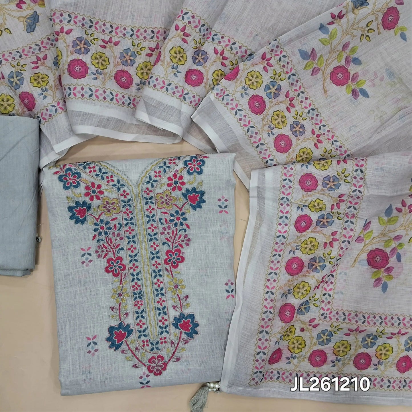 Light grey semi linen unstitched salwar material, thread embroidery work on yoke, printed all over, printed daman,(lining needed)spun cotton bottom,floral printed semi linen dupatta. JL261210