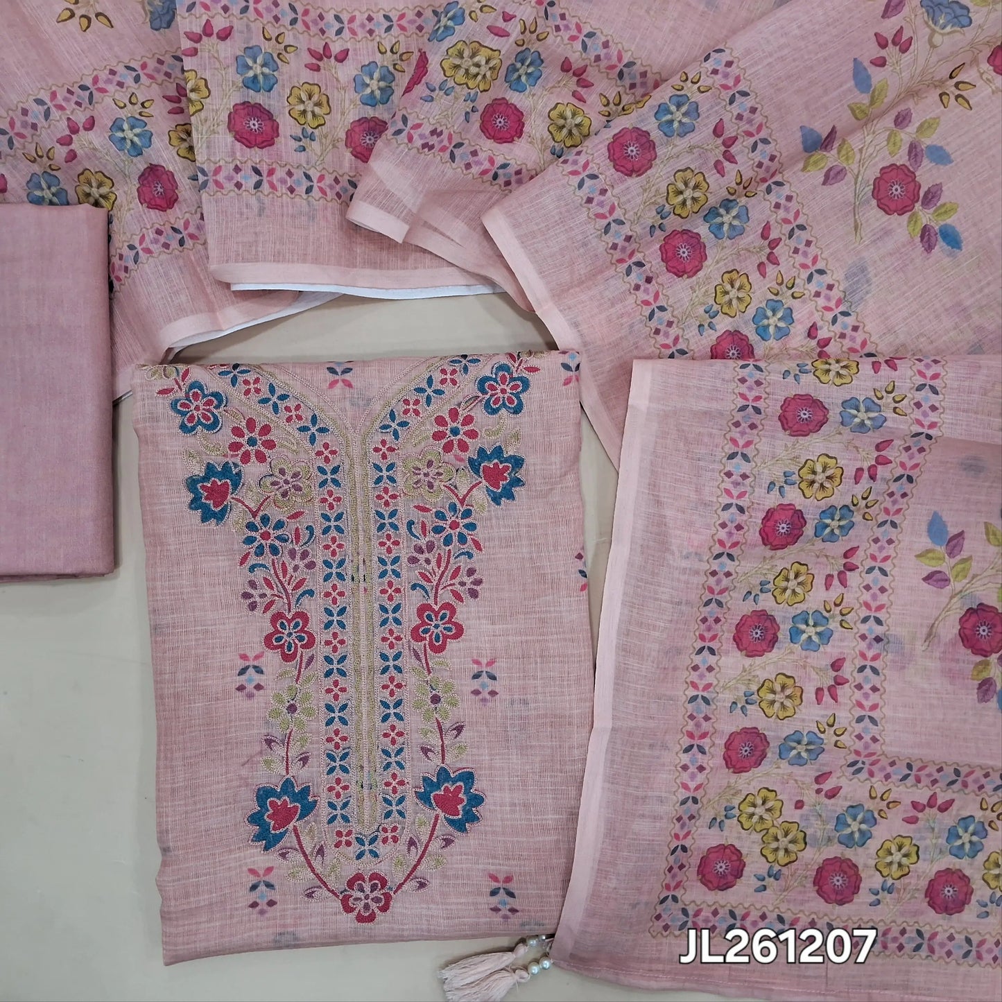 Peachish pink semi linen unstitched salwar material, thread embroidery work on yoke, printed all over, printed daman,(lining needed)spun cotton bottom,floral printed semi linen dupatta. JL261207