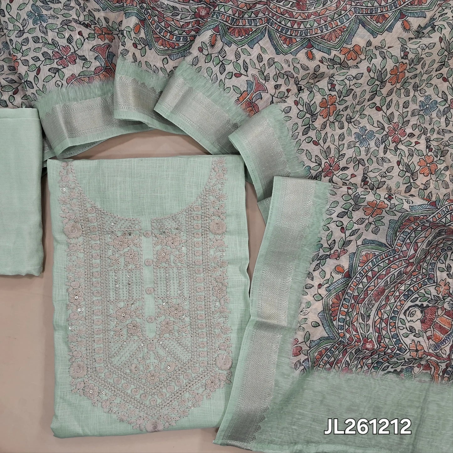 Pastel green semi linen unstitched salwar material, embroidery work on yoke, (lining needed)santoon bottom,madhubani printed semi linen dupatta with gold borders. JL261212