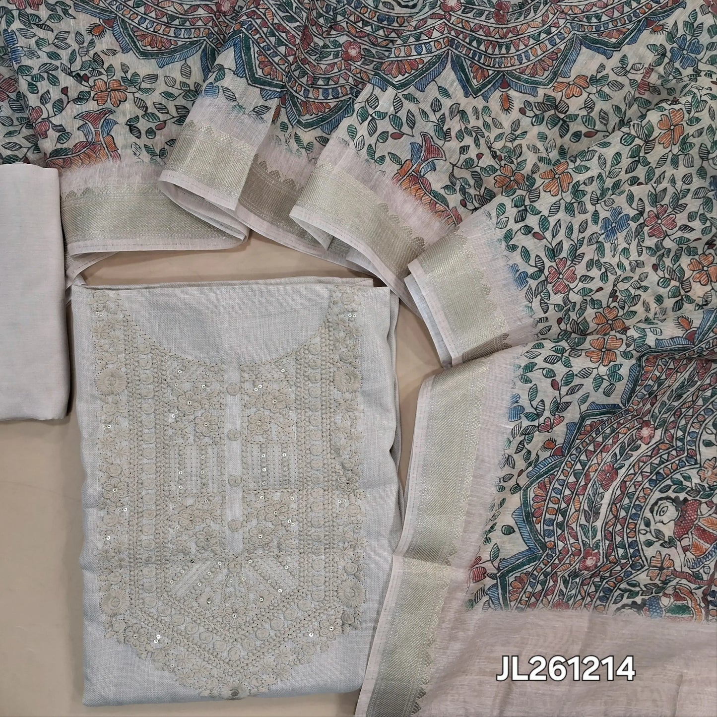 Light beige semi linen unstitched salwar material, embroidery work on yoke, (lining needed)santoon bottom,madhubani printed semi linen dupatta with gold borders. JL261214