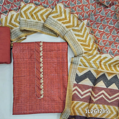 Brick red jute silk unstitched salwar material, potli buttons and lace work on yoke, printed daman,( textured,lining needed)silk cotton bottom,printed jute silk dupatta. JL261215