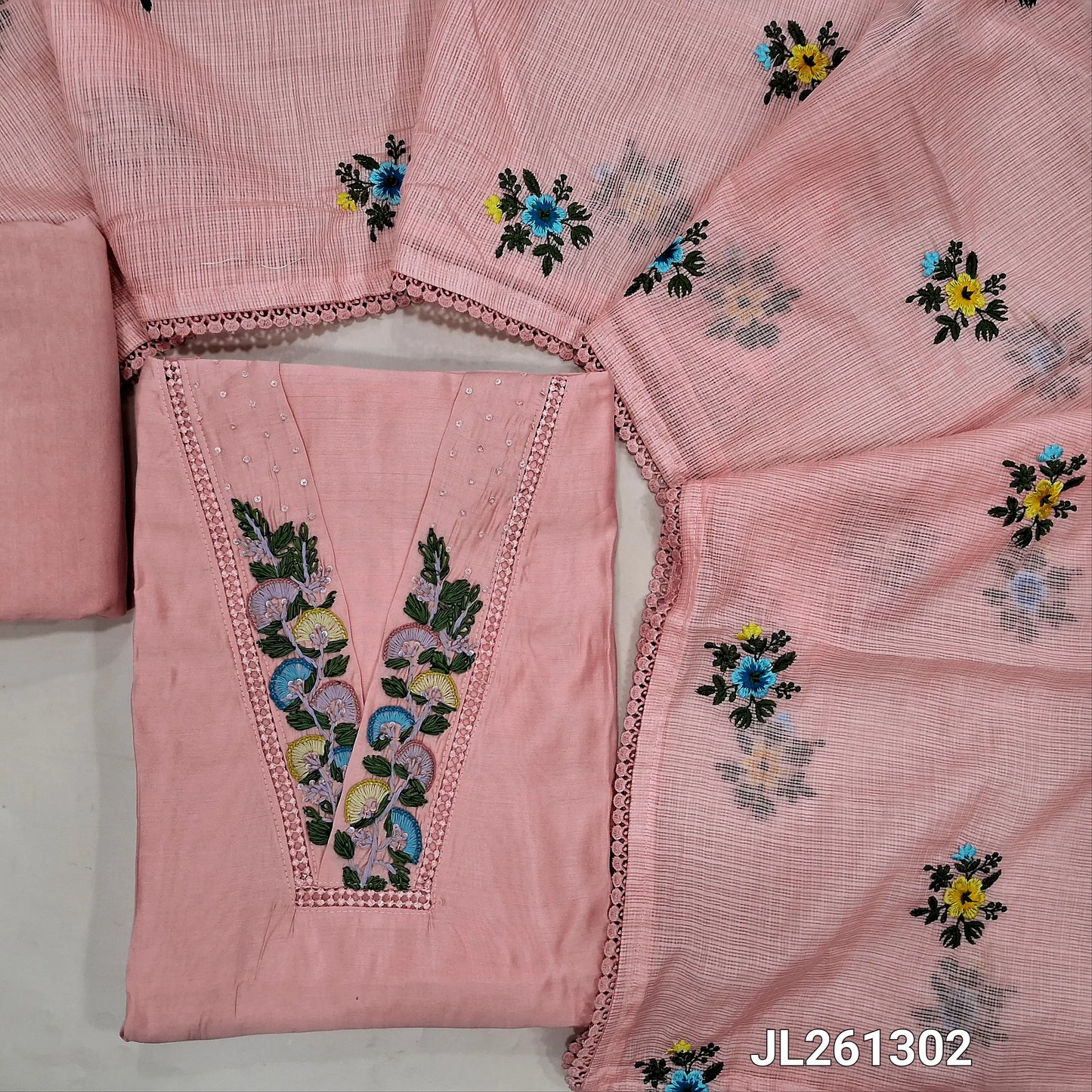 Designer pastel pink mul chanderi unstitched salwar material, V neck with hand embroidery and lace work on yoke,(thin, lining needed) spun cotton bottom,thread embroidery work on kota dupatta with lace tapping. JL261302