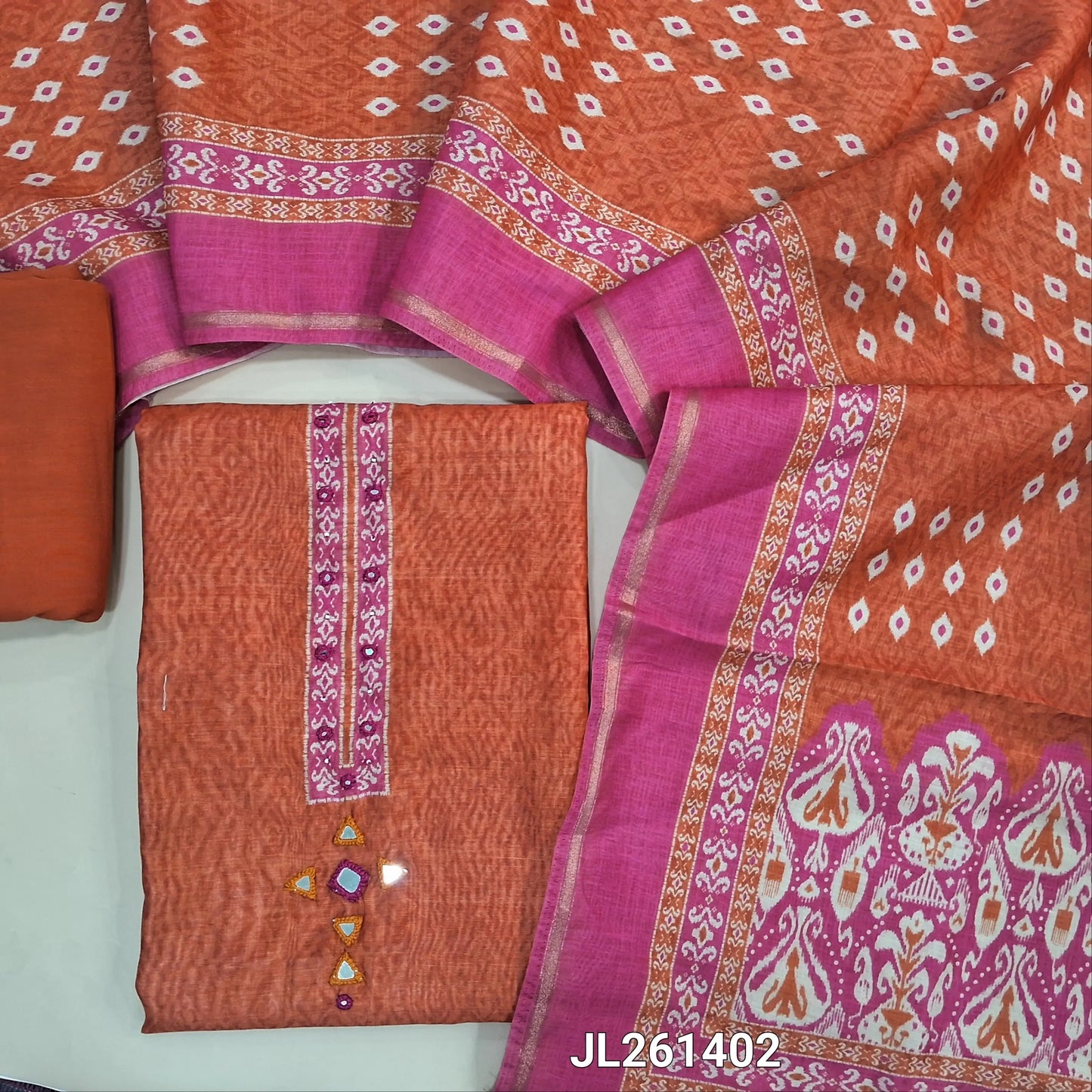 Rust orange & pink digital printed chanderi silk cotton unstitched salwar material,printed yoke with mirror work(Lining Needed)spun cotton bottom, digital printed chanderi silk cotton dupatta with tissue borders and lace tapping. JL261402