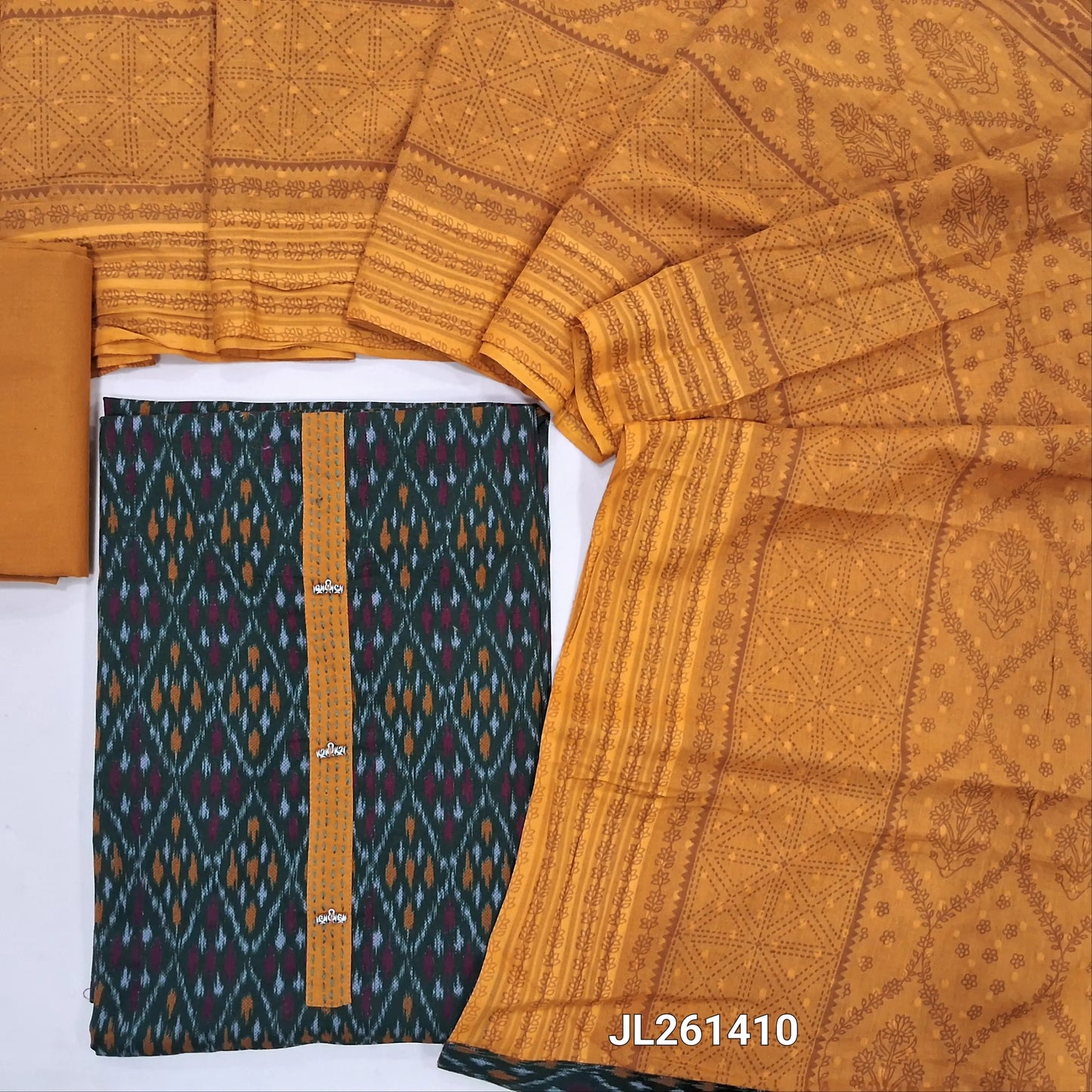Dark green ikat printed pure cotton unstitched salwar material,fancy buttons on yoke,(lining optional)mehandhi yellow cotton bottom, block printed and self design on pure mul cotton dupatta. JL261410