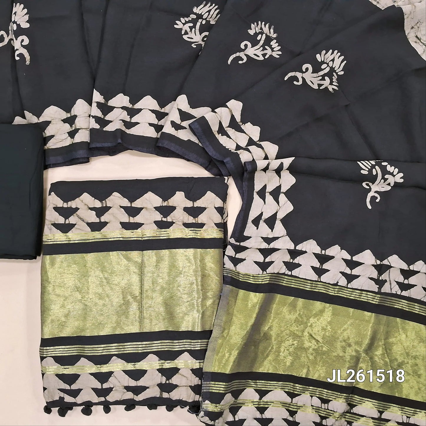 Black wax batik soft silk cotton unstitched salwar material,tissue daman with pom pom tapping(lining needed)spun cotton bottom, wax batik on silk cotton dupatta with tissue pallu and pom pom tapping. JL261518