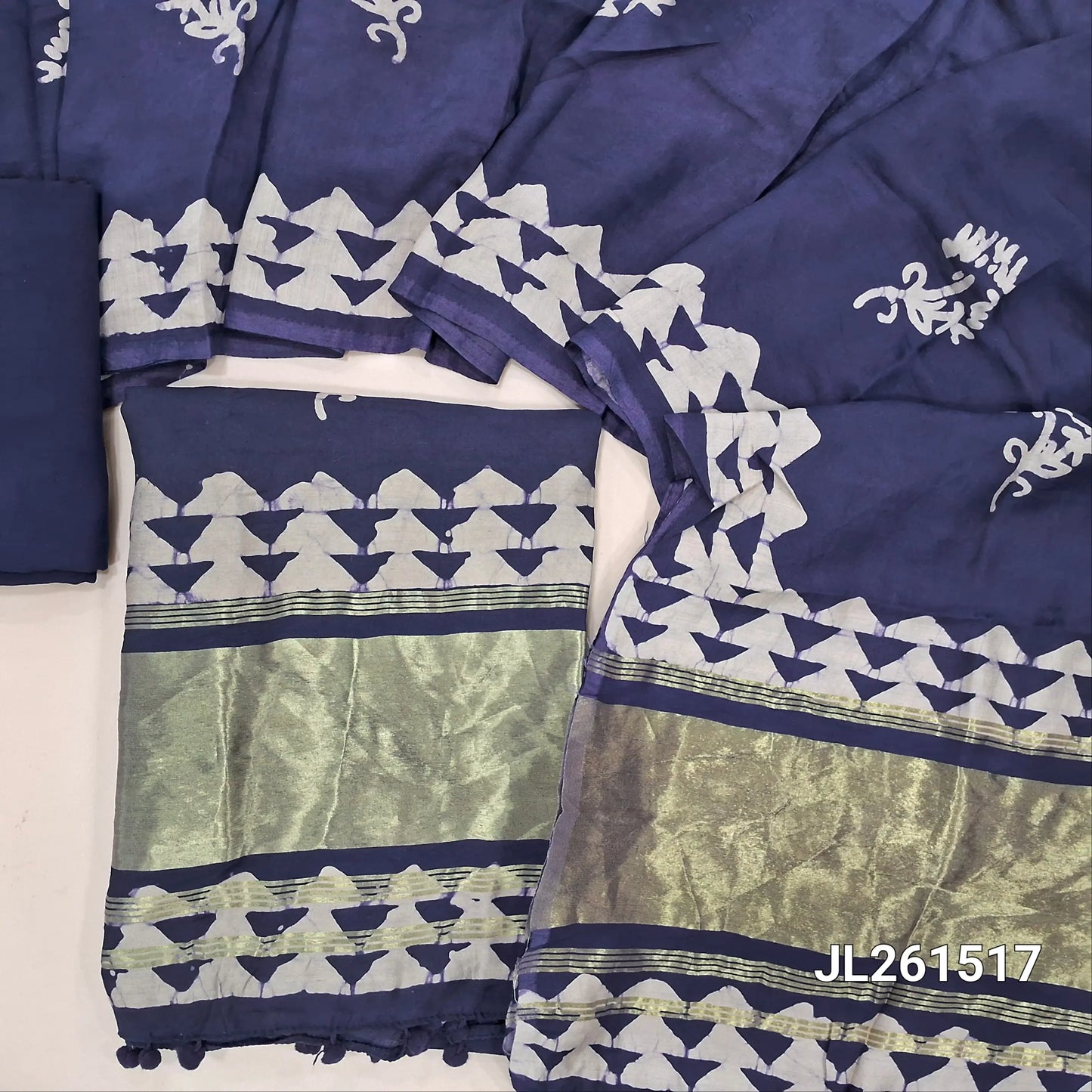Dark blue wax batik soft silk cotton unstitched salwar material,tissue daman with pom pom tapping(lining needed)spun cotton bottom, wax batik on silk cotton dupatta with tissue pallu and pom pom tapping. JL261517