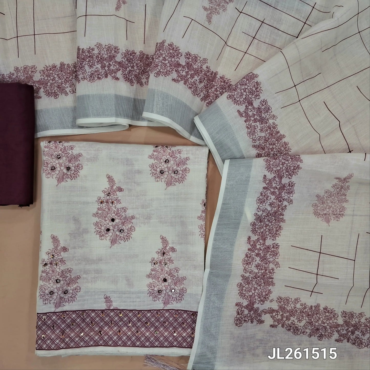 Off white base printed semi linen unstitched salwar material,faux mirror and sequins work on front, (lining needed)pink silky bottom,printed semi linen dupatta with silver tissue border and tassles. JL261515