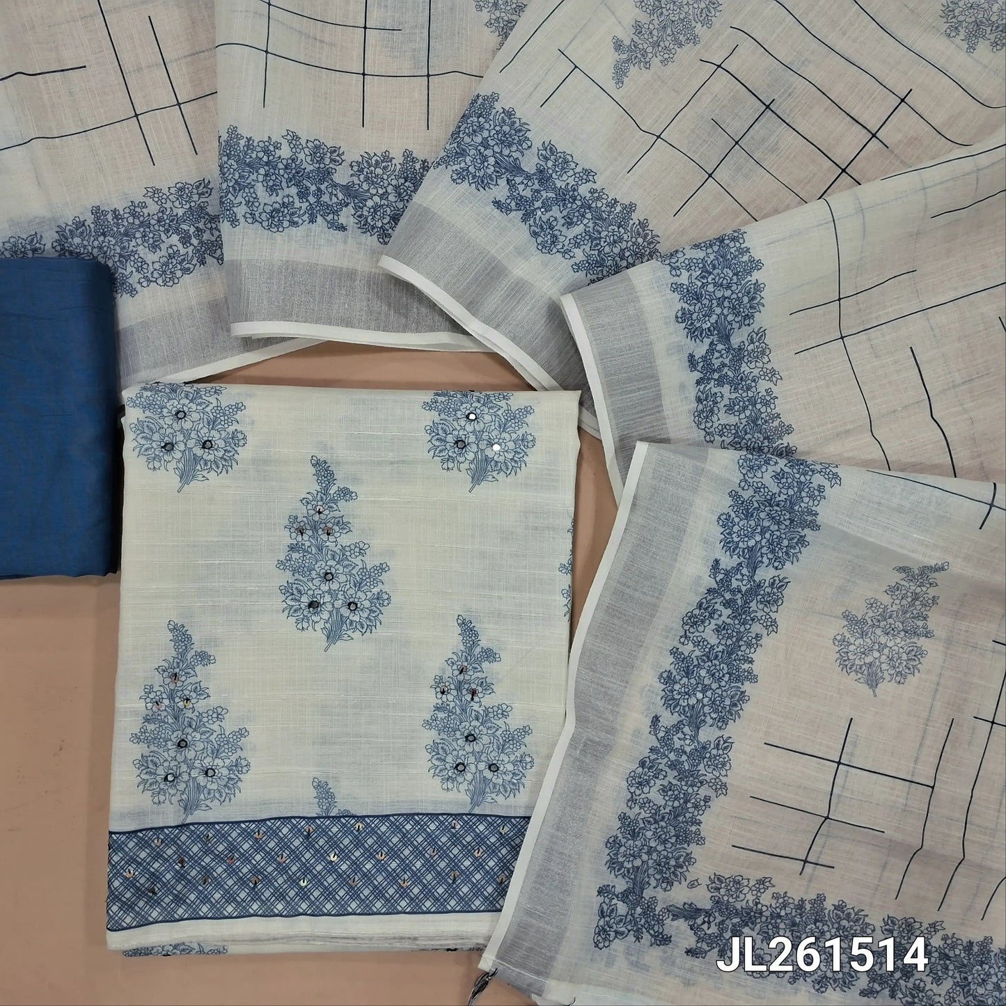 Off white base printed semi linen unstitched salwar material,faux mirror and sequins work on front, (lining needed)blue silky bottom,printed semi linen dupatta with silver tissue border and tassles. JL261514