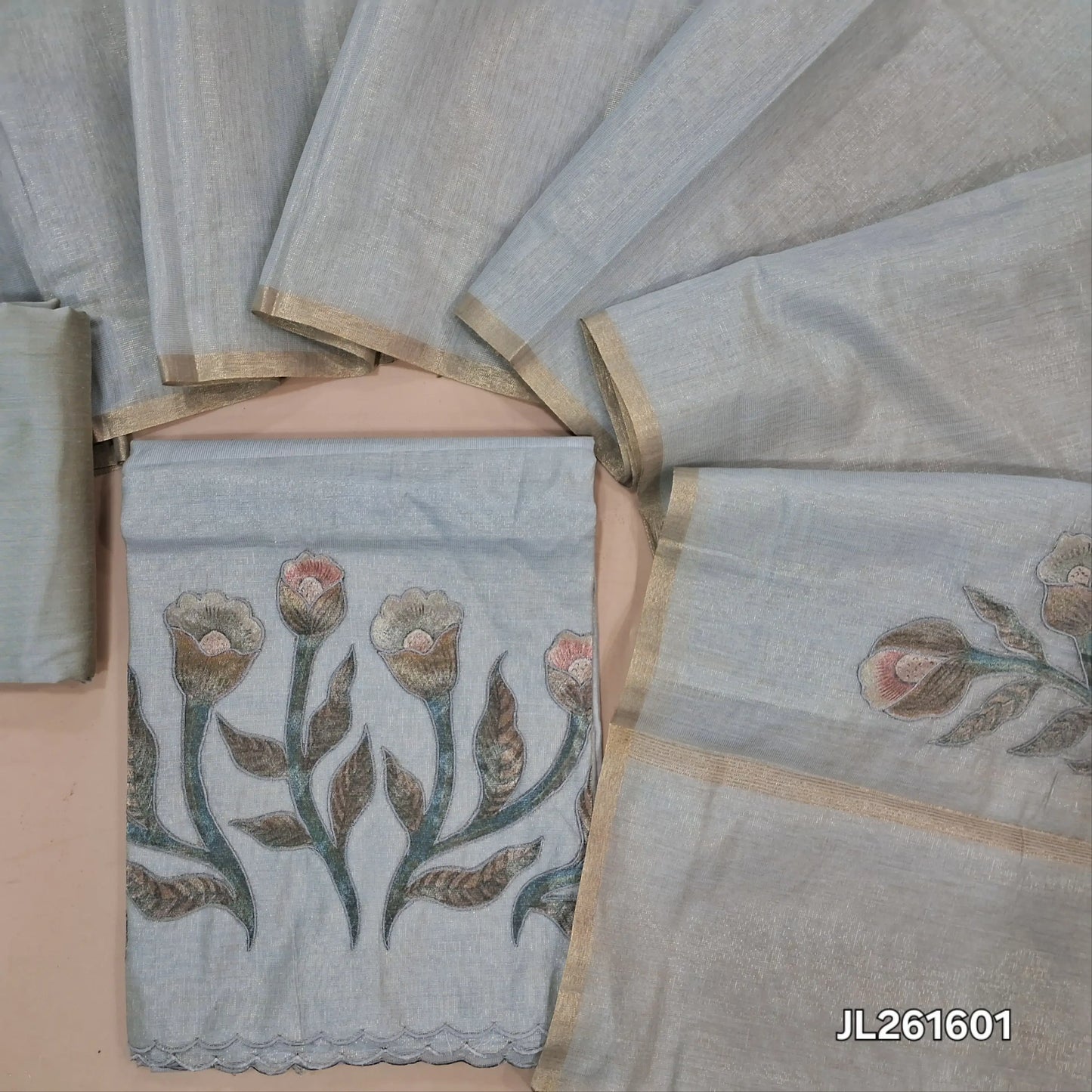 Silver grey with golden tint tissue silk cotton unstitched salwar material,applique work on daman (thin, lining needed)silk cotton bottom, applique work on full length tissue silk cotton dupatta with gold tissue borders. JL261601