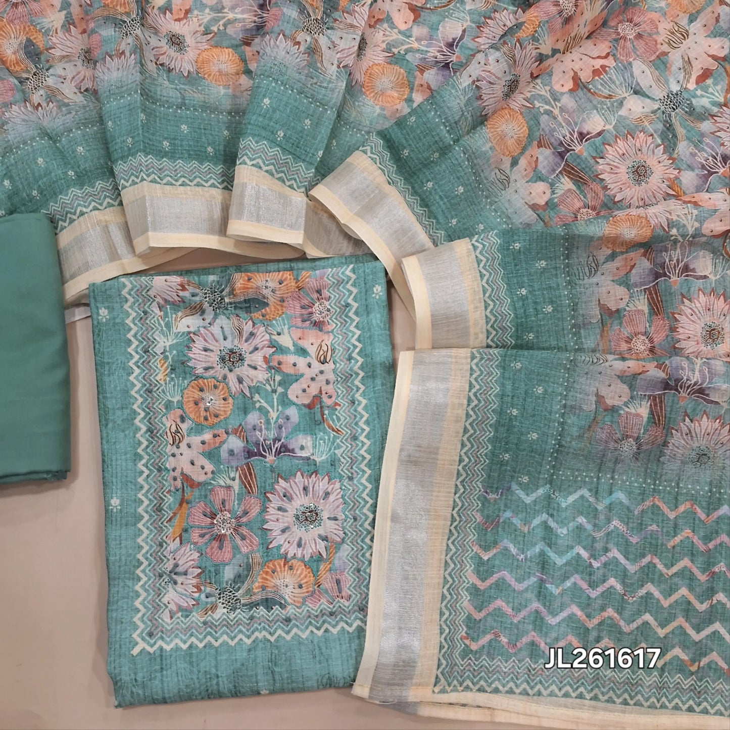Pastel blue semi linen unstitched salwar material,floral, hand embroidery,sequins work on yoke,(lining needed)spun cotton bottom,digital printed semi linen dupatta with silver tissue borders. JL261617