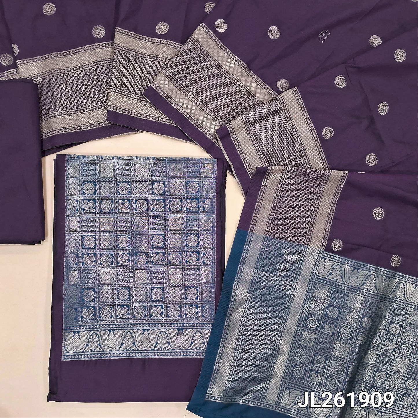 Dark purple benarasi silk cotton unstitched salwar material,(TEAL BLUE)brocade weaving yoke patch and daman (lining needed)silk cotton bottom,zari buttas on full length silk cotton dupatta with borders and contrast pallu. JL261909