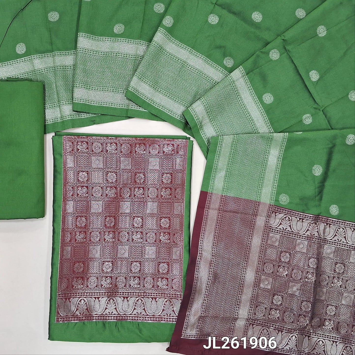 Leaf green benarasi silk cotton unstitched salwar material,(MAROON)brocade weaving yoke patch and daman (lining needed)silk cotton bottom,zari buttas on full length silk cotton dupatta with borders and contrast pallu. JL261906