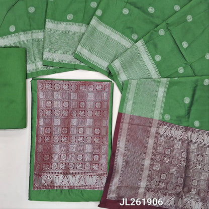 Leaf green benarasi silk cotton unstitched salwar material,(MAROON)brocade weaving yoke patch and daman (lining needed)silk cotton bottom,zari buttas on full length silk cotton dupatta with borders and contrast pallu. JL261906