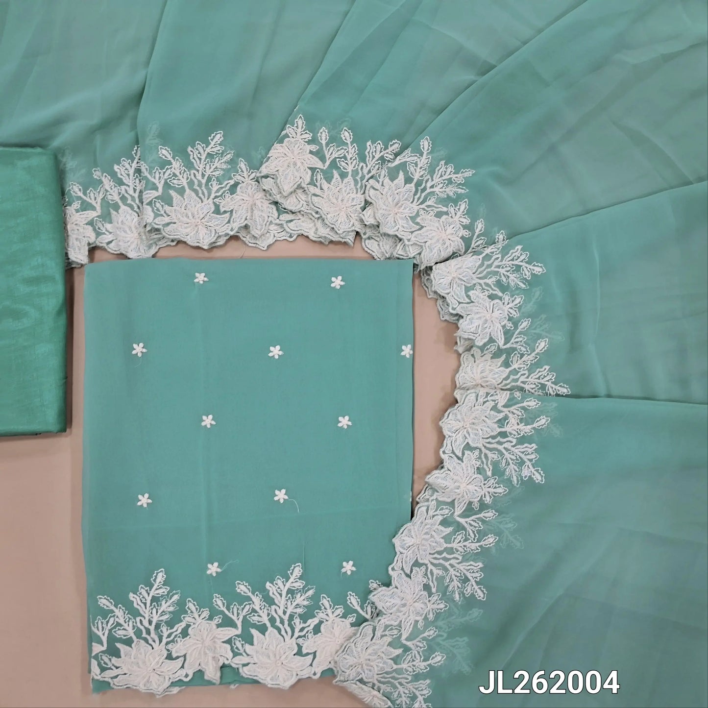 Pastel blue semi georgette unstitched salwar material, floral embroidery on front,embroidery and cut work daman(soft,Lining Needed)matching silky fabric provided for both bottom and lining,semi georgette with embroidery and cut work borders. JL262004
