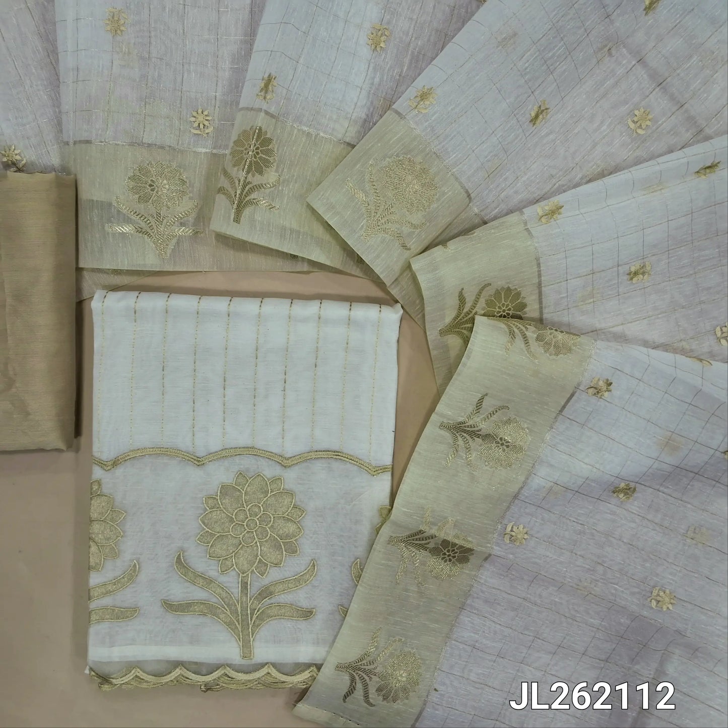 Off white slub silk cotton unstitched salwar material,kantha stitch on front,applique work with organza daman,(lining needed)beige silk cotton bottom, embroidery and zari checks on slub silk cotton dupatta with zari woven borders. JL262112