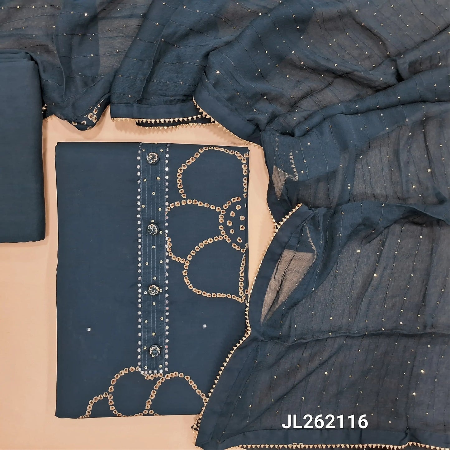 Dark teal blue soft silk cotton unstitched salwar material, fancy buttons on yoke(lining optional)matching santoon bottom, fancy chiffon dupatta with sequins& kota lace tapings. JL262116