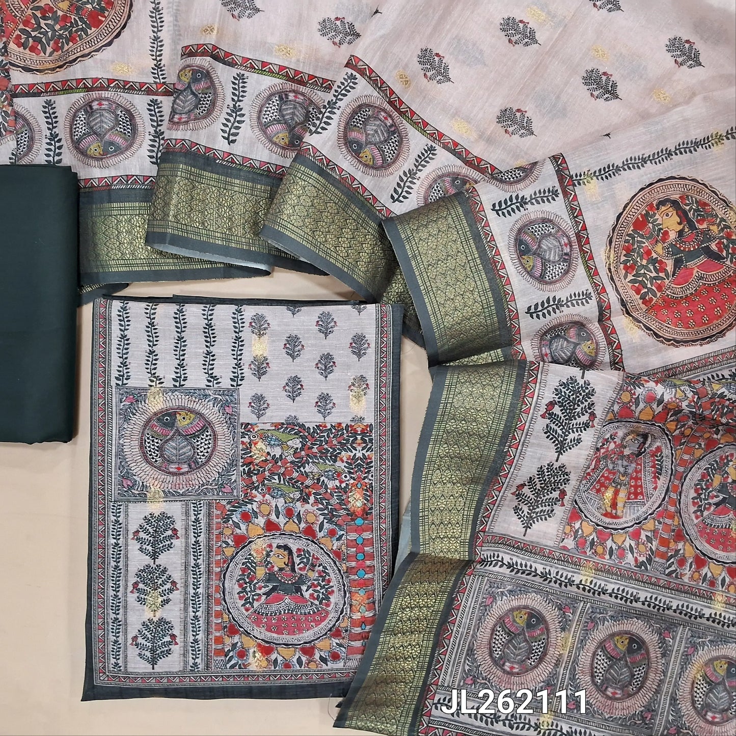 Dark grey semi tussar unstitched salwar material, madhubani printed yoke,zari buttas all over, (Lining needed)spun cotton bottom,digital printed semi tussar dupatta with madhubani pallu and zari woven borders. JL262111
