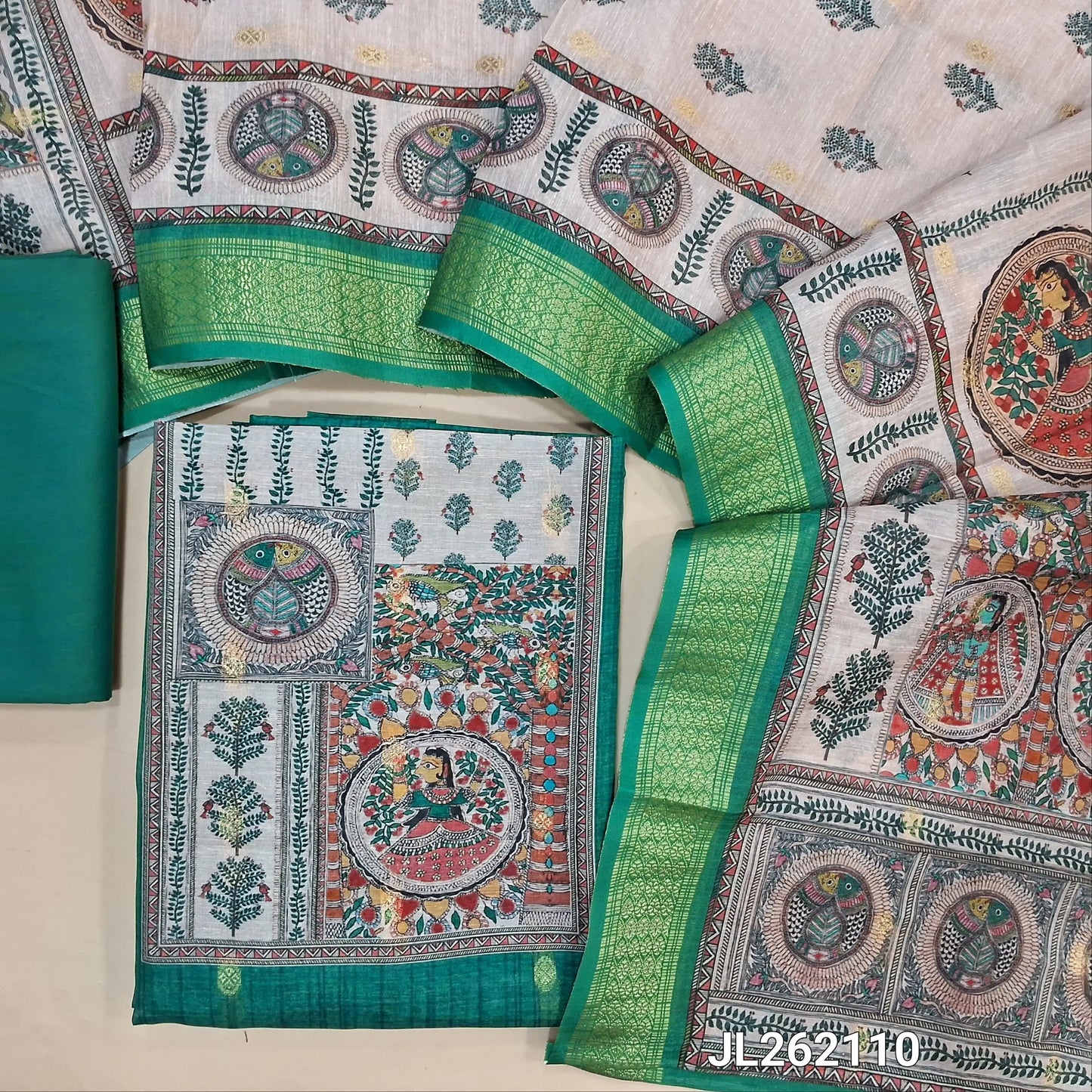 Turquoise green semi tussar unstitched salwar material, madhubani printed yoke,zari buttas all over, (Lining needed)spun cotton bottom,digital printed semi tussar dupatta with madhubani pallu and zari woven borders. JL262110