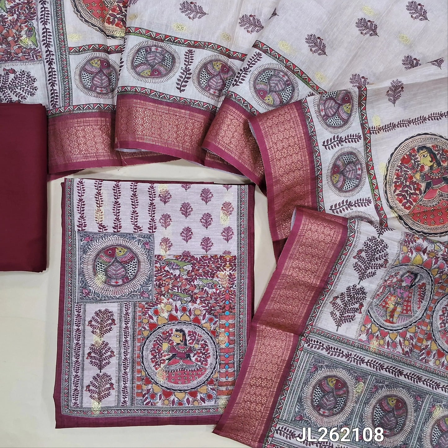 Beetroot purple semi tussar unstitched salwar material, madhubani printed yoke,zari buttas all over, (Lining needed)spun cotton bottom,digital printed semi tussar dupatta with madhubani pallu and zari woven borders. JL262108