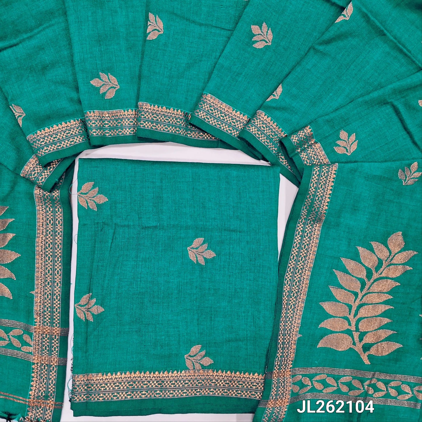 Peacock green premium mulberry silk unstitched salwar material, zari buttas all over,zari woven borders, (lining needed)mulberry silk bottom with zari borders, rich weaving on mulberry silk dupatta with pallu and tassels. JL262104