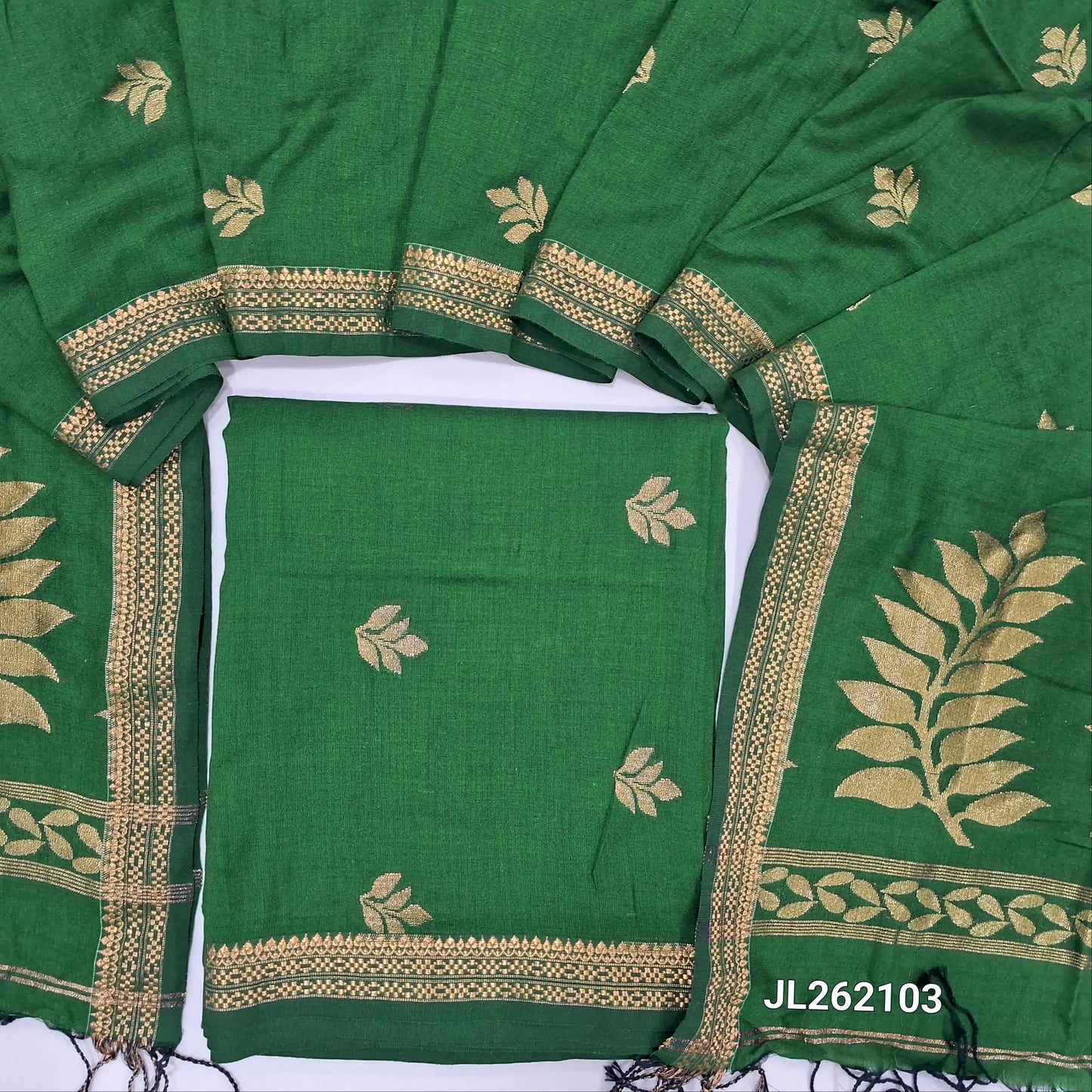Leafy green premium mulberry silk unstitched salwar material, zari buttas all over,zari woven borders, (lining needed)mulberry silk bottom with zari borders, rich weaving on mulberry silk dupatta with pallu and tassels. JL262103