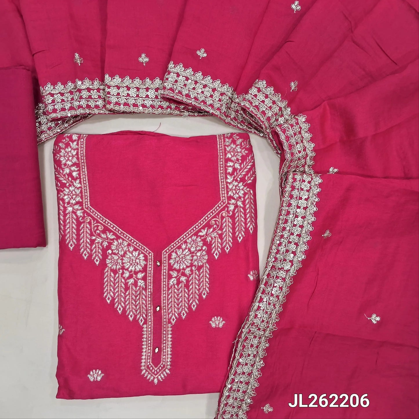 Bright pink semi dola silk unstitched salwar material, zari weaving design on front(silky fabric, lining needed)santoon bottom, zari& sequins work on short width soft silk cotton dupatta. JL262206