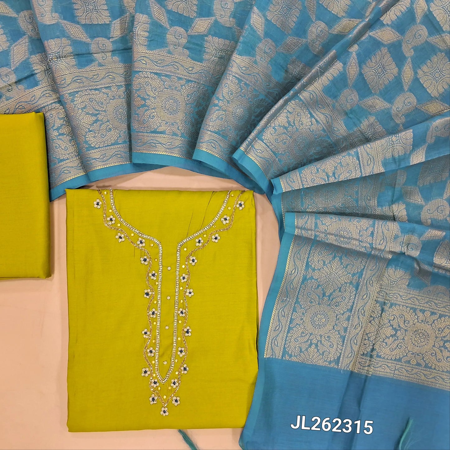 Mehandhi Yellow soft silk cotton unstitched salwar material(lining needed) bead, zardozi work on yoke, matching soft silk cotton bottom,  heavy benarasi weaving blue silk cotton dupatta with tassels. JL262315