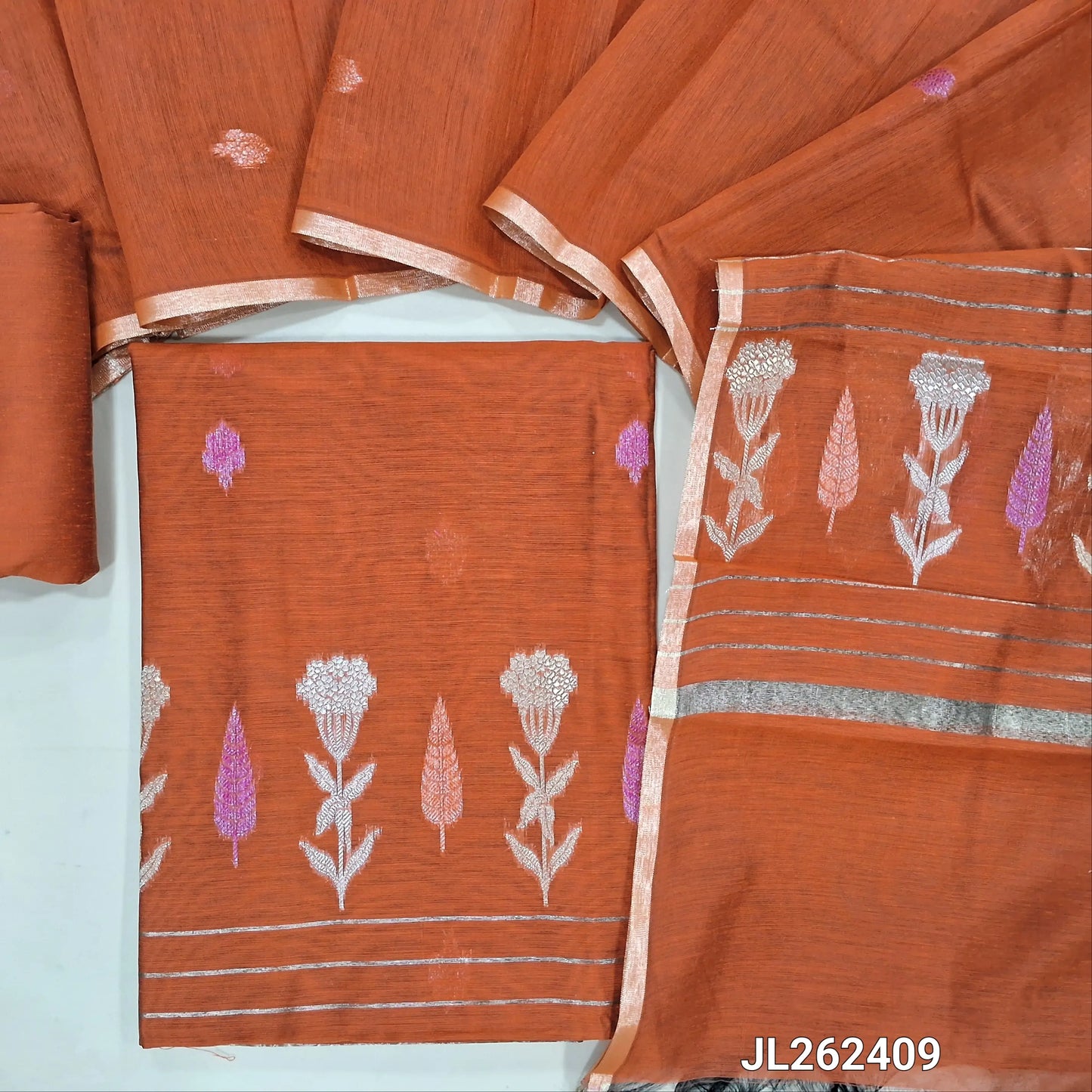 Rust orage silk cotton unstitched salwar material,buttas all over,thread and zari weaving daman, (lining needed)silk cotton bottom,zari buttas on  silk cotton dupatta with zari weaving pallu. JL262409