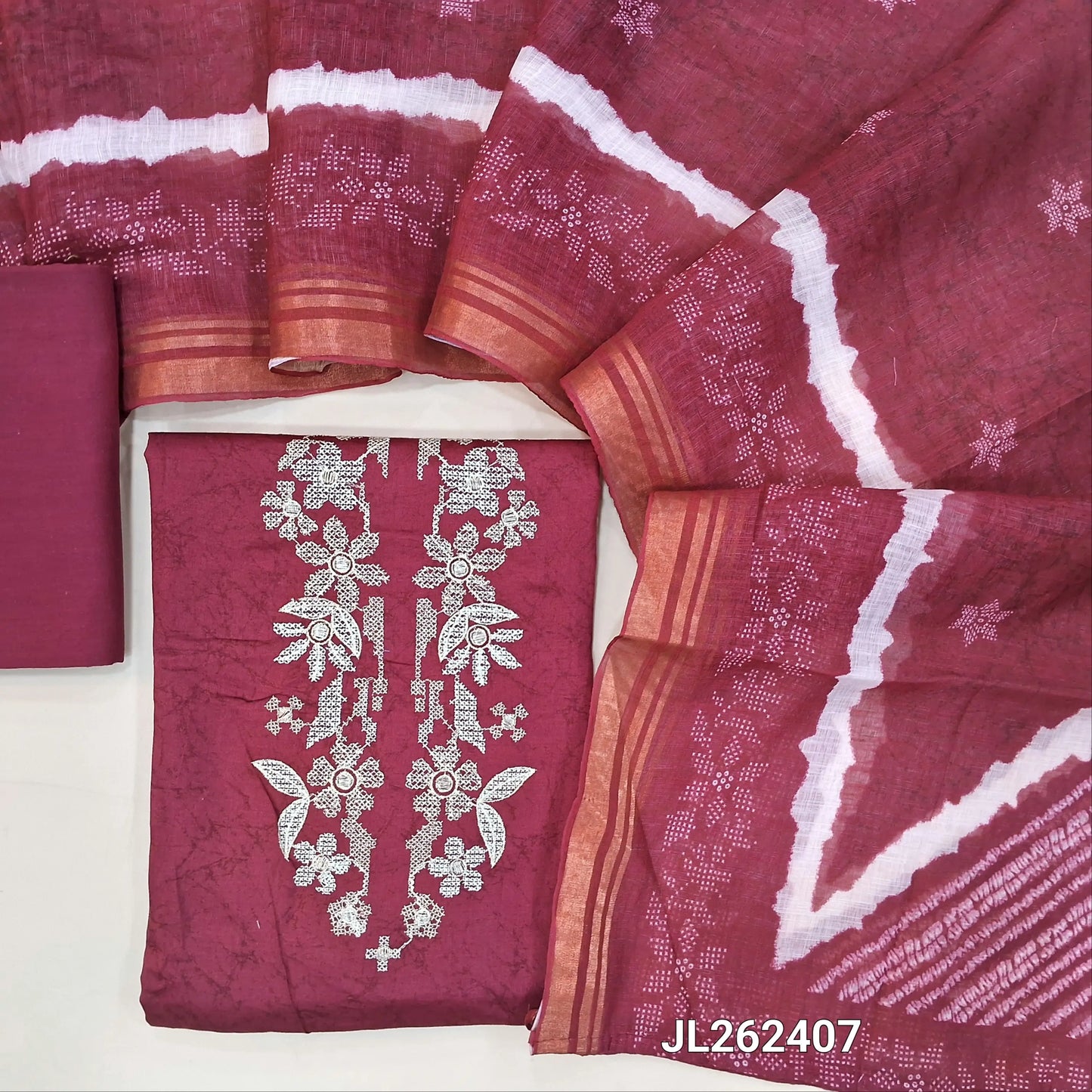 Dark pink satin cotton unstitched salwar material,thread and zari work on yoke,shibori print on daman,(lining optional)coton bottom, shibori design on semi linen dupatta with tissue borders. JL262407