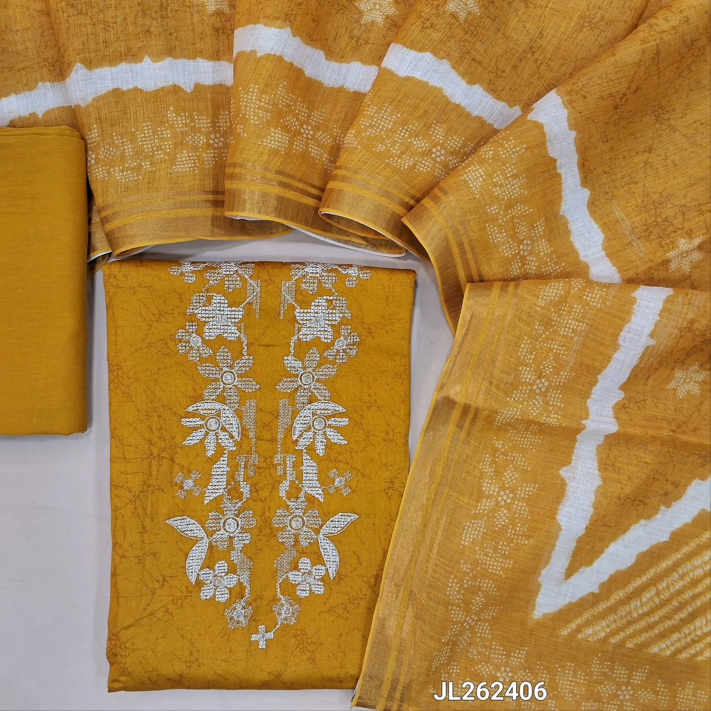 Mehandhi yellow satin cotton unstitched salwar material,thread and zari work on yoke,shibori print on daman,(lining optional)coton bottom, shibori design on semi linen dupatta with tissue borders. JL262406