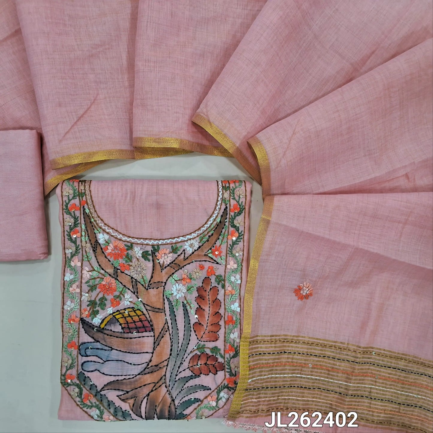 Pastel pink premium muga silk cotton unstitched salwar material, digital printed with rich hand embroidery work on yoke,embroidery on front,(lining needed)santoon bottom, hand embroidery work on muga silk cotton dupatta with tissue borders. JL262402