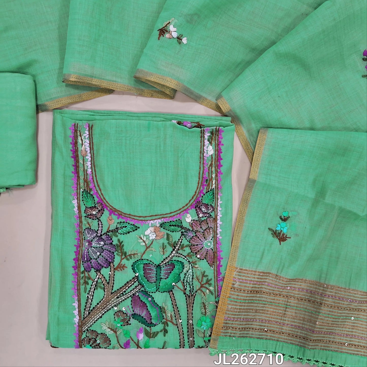 Sea green premium muga silk cotton unstitched salwar material, brush paint with rich hand embroidery work on yoke,embroidery on front,(lining needed)santoon bottom, hand embroidery work on muga silk cotton dupatta with tissue borders. JL262710