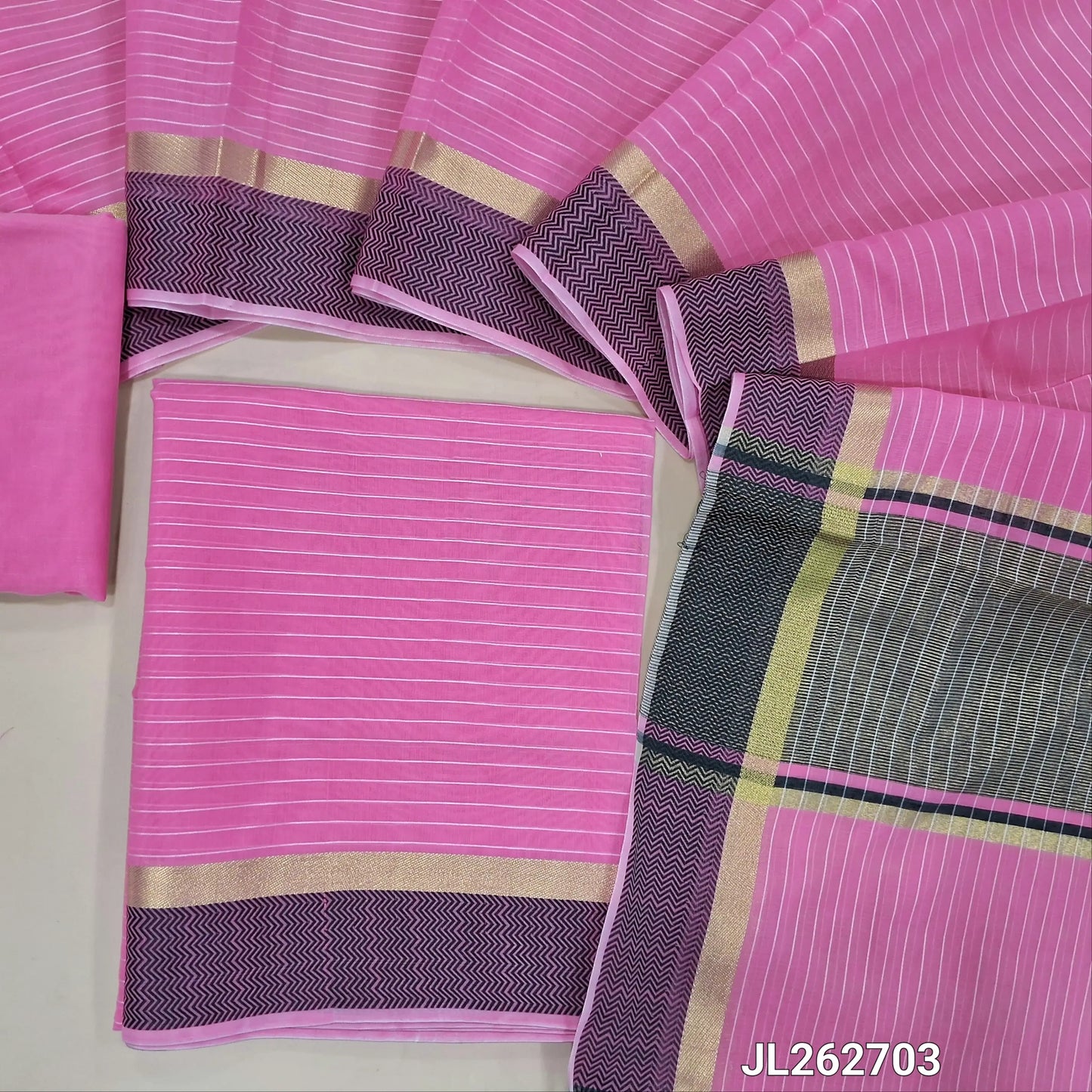 Pink silk cotton unstitched salwar material,thread woven lines all over, thread woven daman,(lining needed)thin silk cotton fabric provided for lining, NO BOTTOM, silk cotton dupatta with gold tissue pallu and thread woven borders. JL262703