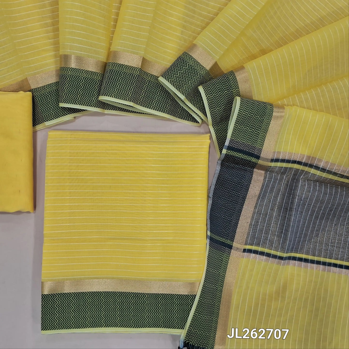 Pastel yellow silk cotton unstitched salwar material,thread woven lines all over, thread woven daman,(lining needed)thin silk cotton fabric provided for lining, NO BOTTOM, silk cotton dupatta with gold tissue pallu and thread woven borders. JL262707